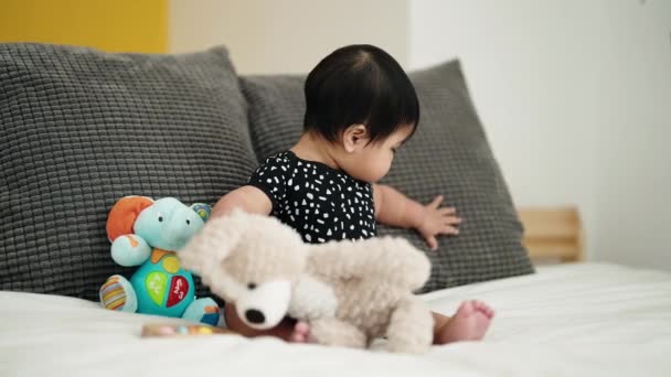 Adorable Hispanic Baby Playing Dolls Sitting Bed Bedroom — Video