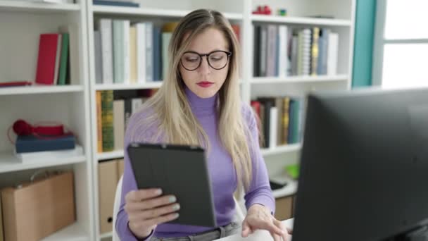 Young Blonde Woman Student Using Computer Touchpad Studying Library University — Vídeo de Stock