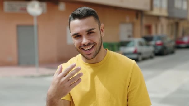 Young Hispanic Man Smiling Confident Doing Coming Gesture Hand Street — 비디오