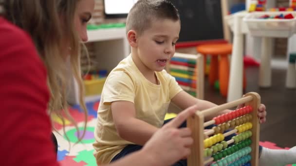 Teacher Toddler Learning Maths Abacus Sitting Floor Kindergarten — Stock Video