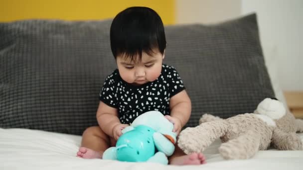 Adorable Hispanic Baby Playing Dolls Sitting Bed Bedroom — Stock Video