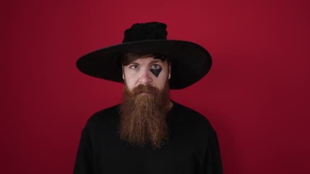 Young Redhead Man Wearing Wizard Costume Doing Scare Expression Isolated — Stockvideo