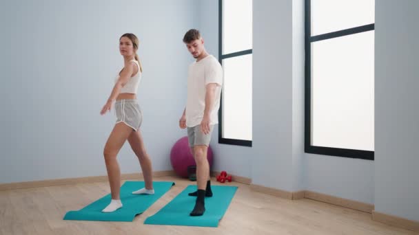 Young Couple Smiling Confident Training Yoga Sport Center — Wideo stockowe