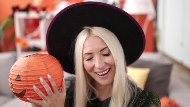 Young Blonde Woman Wearing Witch Costume Holding Halloween Pumpkin Basket — Stock video