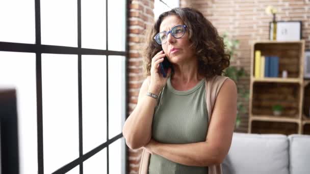Middle Age Hispanic Woman Speaking Phone — Video