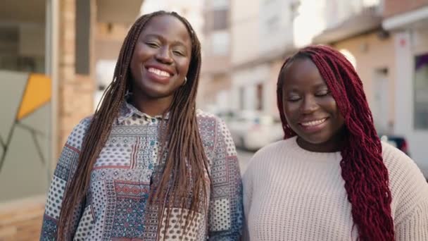 Two African American Women Smiling Confident Wearing Medical Mask Street — Stock Video