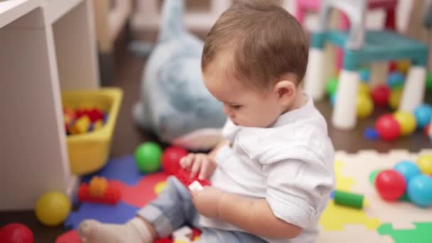 Adorable Toddler Playing Toys Sitting Floor Kindergarten — Vídeo de Stock