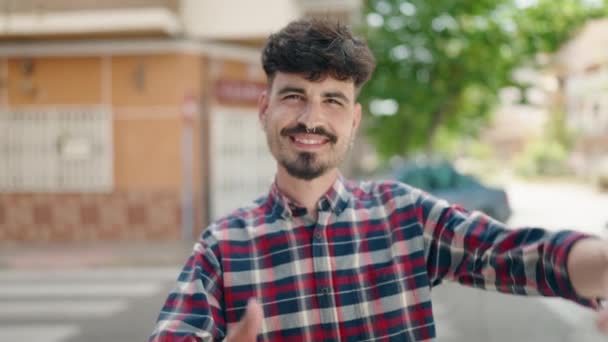 Young Hispanic Man Smiling Confident Doing Photo Gesture Hands Street — Wideo stockowe