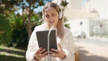 Young woman smiling confident having video call at park