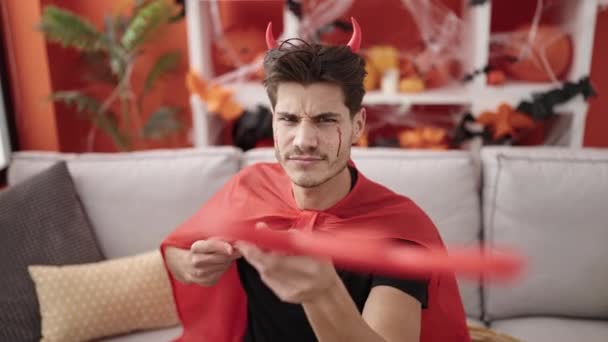 Young Hispanic Man Wearing Devil Costume Holding Trident Home — Vídeo de Stock