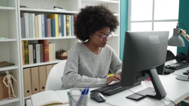 African American Woman Student Using Computer Writing Notebook Library University — Vídeo de Stock