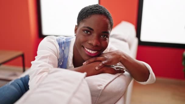 African American Woman Smiling Confident Sitting Sofa Home — Stockvideo