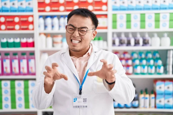 Chinese Young Man Working Pharmacy Drugstore Smiling Funny Doing Claw — Stock Photo, Image