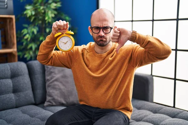 Young Bald Man Beard Holding Alarm Clock Angry Face Negative — Stock Photo, Image