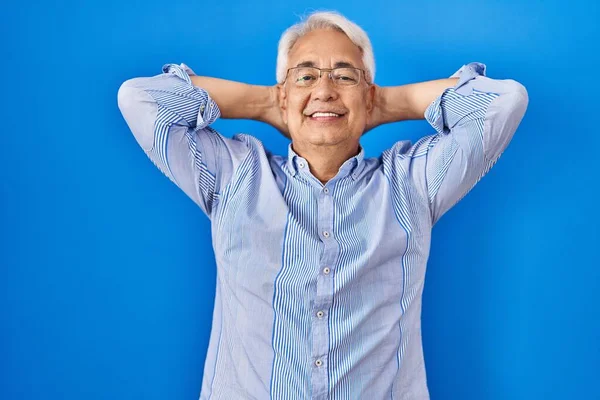 Hispanic Senior Man Wearing Glasses Relaxing Stretching Arms Hands Head — Stock Photo, Image