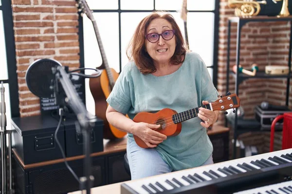 Senior Woman Musician Smiling Confident Playing Ukulele Music Studio — ストック写真