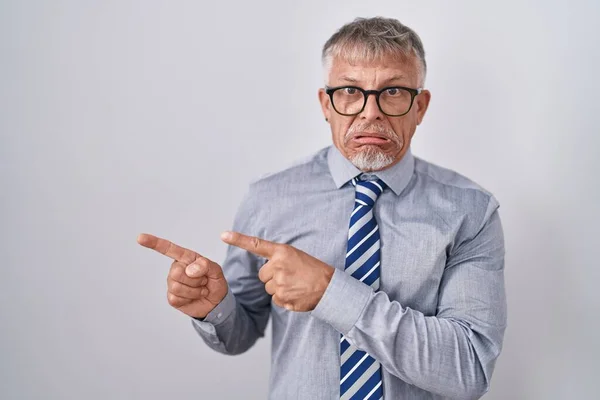 Hispanic Business Man Grey Hair Wearing Glasses Pointing Aside Worried — Stock Photo, Image