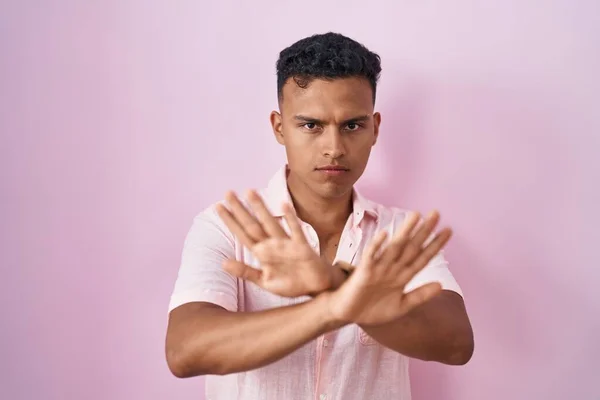 Young Hispanic Man Standing Pink Background Rejection Expression Crossing Arms — Stok fotoğraf