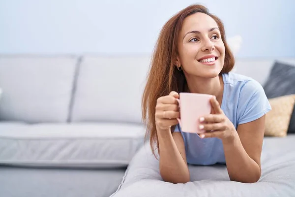 Young Woman Drinking Coffee Lying Sofa Home — Stock Photo, Image