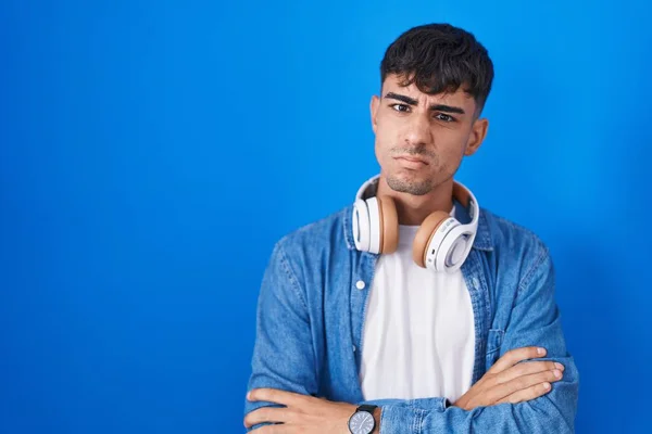 Young Hispanic Man Standing Blue Background Skeptic Nervous Disapproving Expression — Stockfoto