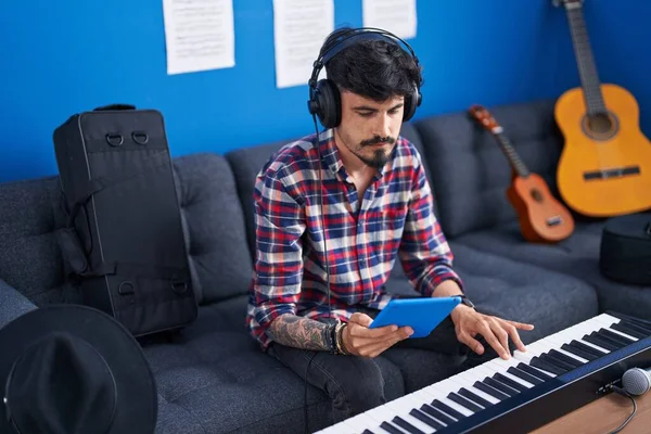 Young Hispanic Man Musician Playing Piano Keyboard Using Touchpad Music —  Fotos de Stock