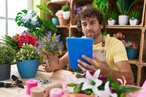 Young Hispanic Man Florist Using Touchpad Holding Lavender Plant Flower — Stock Photo, Image