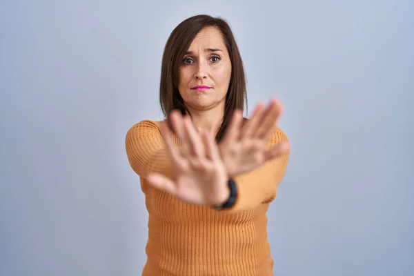 Middle Age Brunette Woman Standing Wearing Orange Sweater Rejection Expression — Stock Photo, Image