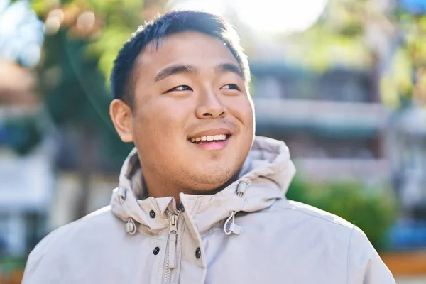 Young Chinese Man Smiling Confident Standing Park — kuvapankkivalokuva