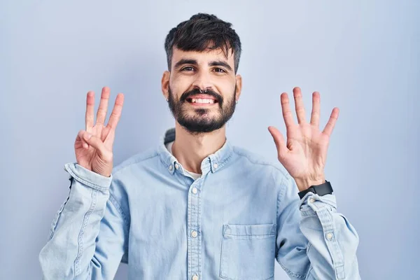 Young Hispanic Man Beard Standing Blue Background Showing Pointing Fingers — Stock Photo, Image