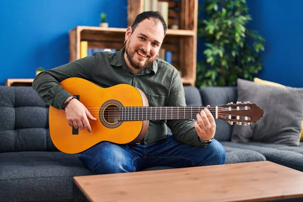 Young Hispanic Man Playing Classical Guitar Sitting Bed Home — Fotografia de Stock