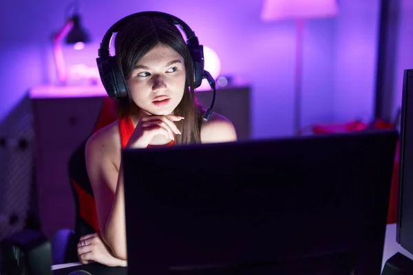 Young Caucasian Woman Streamer Sitting Table Serious Expression Gaming Room — Stockfoto