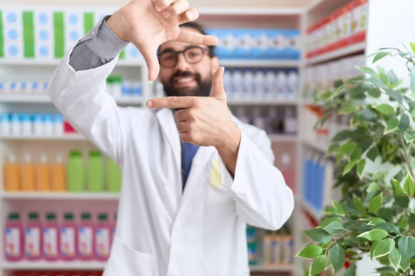 Hispanic Man Beard Working Pharmacy Drugstore Smiling Making Frame Hands — Stock Photo, Image