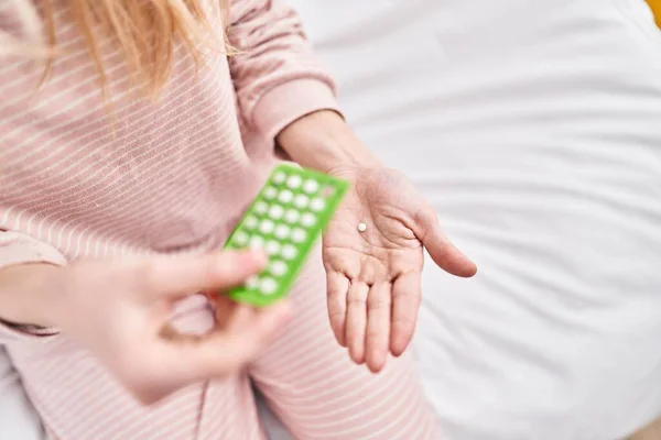Young Blonde Woman Holding Birth Control Pills Sitting Bed Bedroom — Stock fotografie