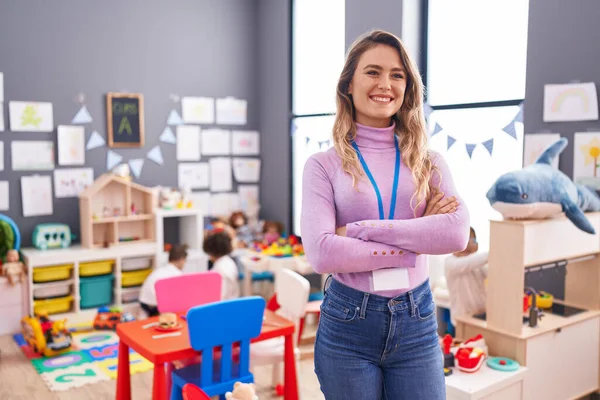 Young Blonde Woman Teacher Smiling Confident Standing Arms Crossed Gesture — Foto de Stock