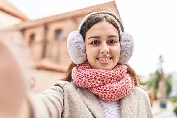 Young Beautiful Hispanic Woman Make Selfie Camera Wearing Scarf Earmuff — 스톡 사진