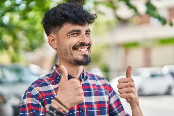 Young Hispanic Man Smiling Confident Doing Gesture Thumbs Street — Stok fotoğraf