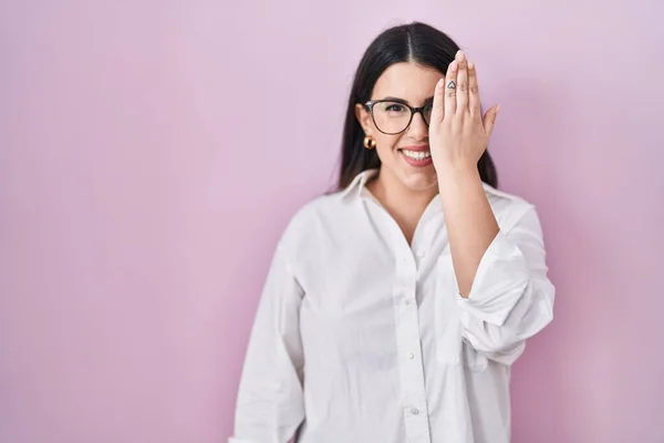 Young Brunette Woman Standing Pink Background Covering One Eye Hand — Stock Photo, Image