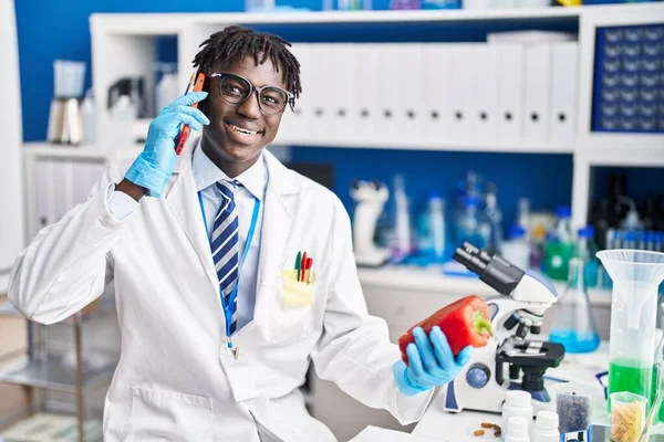 African American Man Scientist Talking Smartphone Holding Pepper Laboratory — Stock Photo, Image