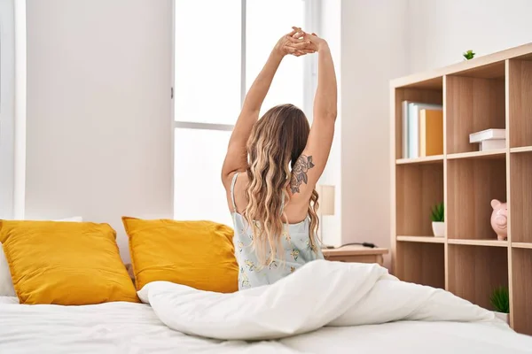 Young Woman Waking Stretching Arms Bedroom — Stockfoto