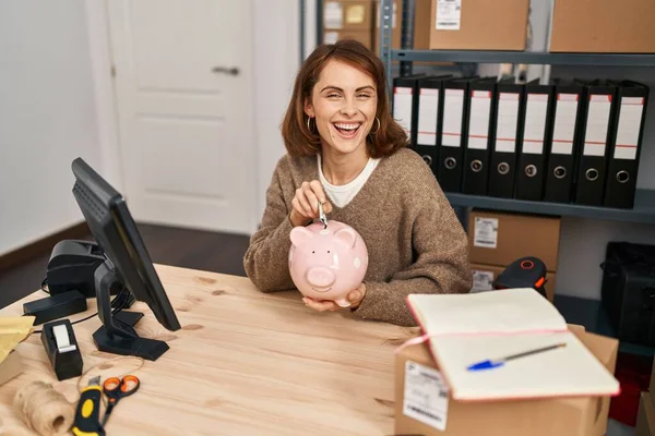 Young Caucasian Woman Ecommerce Business Worker Insert Dollar Piggy Bank — Fotografia de Stock