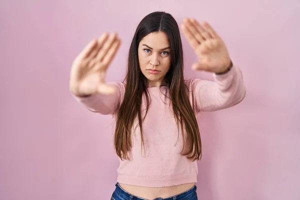 Young Brunette Woman Standing Pink Background Doing Frame Using Hands — Photo