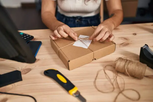 stock image Young beautiful hispanic woman ecommerce business worker smiling confident prepare package at office