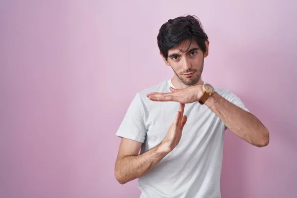 Young Hispanic Man Standing Pink Background Doing Time Out Gesture — стоковое фото
