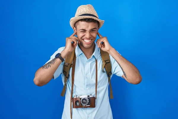Brazilian Young Man Holding Vintage Camera Covering Ears Fingers Annoyed — Stock Photo, Image