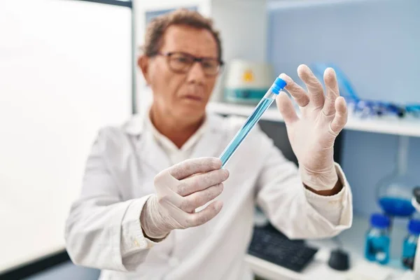Middle Age Man Wearing Scientist Uniform Looking Test Tube Laboratory — Zdjęcie stockowe