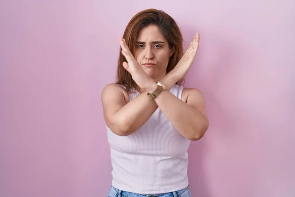 Brunette Woman Standing Pink Background Rejection Expression Crossing Arms Doing — Stock Photo, Image