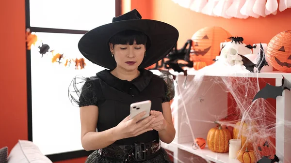 Young Chinese Woman Wearing Witch Costume Using Smartphone Home — Fotografia de Stock