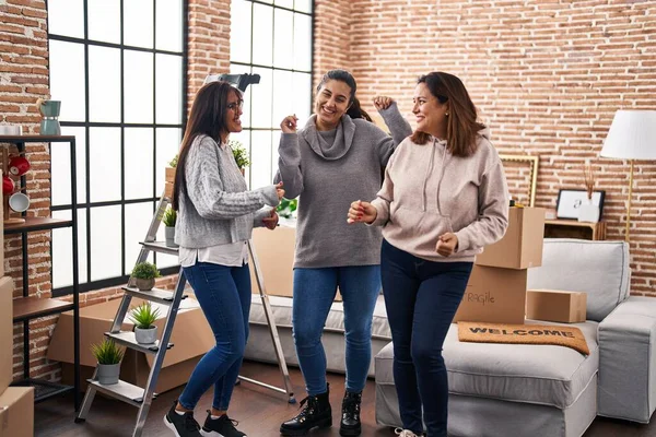Three Woman Smiling Confident Dancing Together New Home — Stok fotoğraf