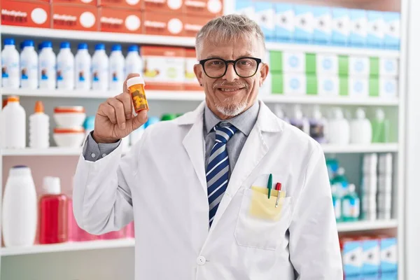 Middle Age Grey Haired Man Pharmacist Holding Capsules Bottle Laboratory — Fotografia de Stock