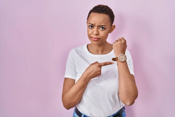 Beautiful African American Woman Standing Pink Background Hurry Pointing Watch — Stock Photo, Image